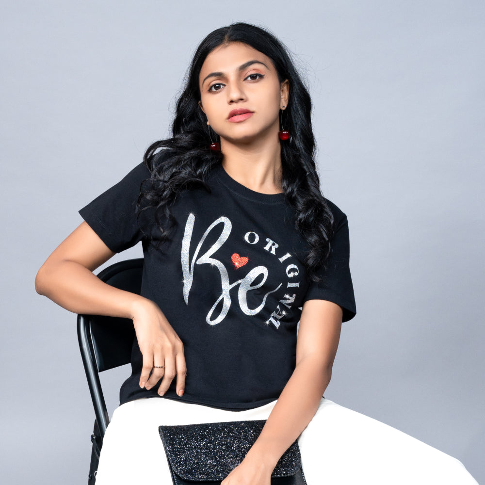 Woman wearing Be Original tee styled with leather jacket and jeans—confident edge