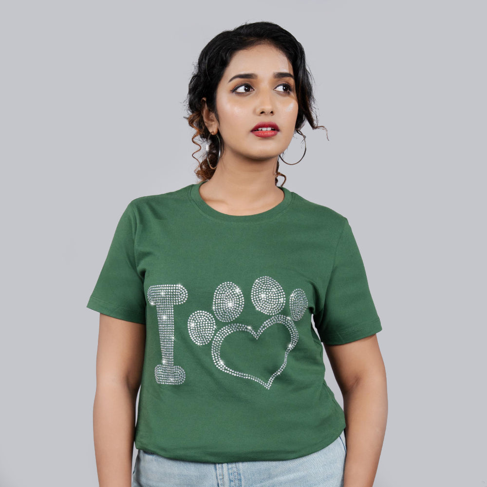 Side view of bottle green Love Paws tee on model, relaxed fit with sparkling motif