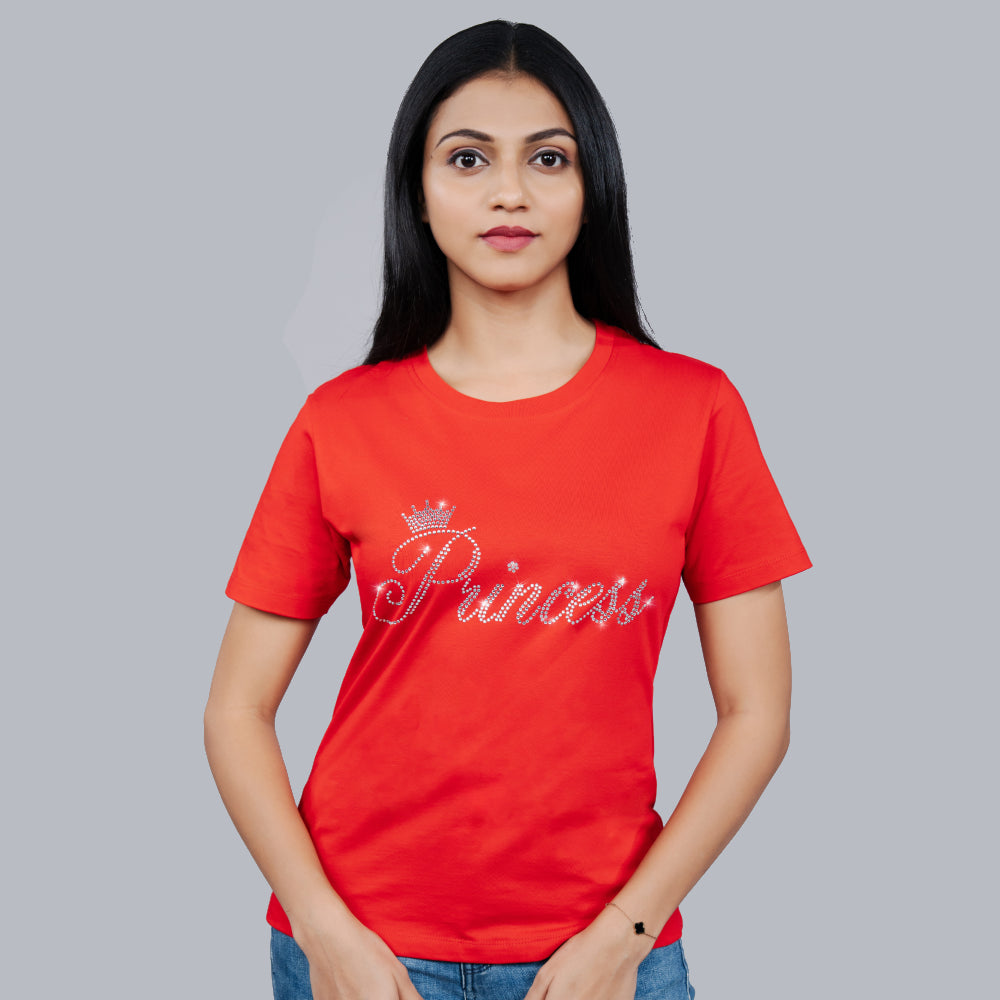 Woman wearing red 'Princess' tee styled with denim—bold, regal look