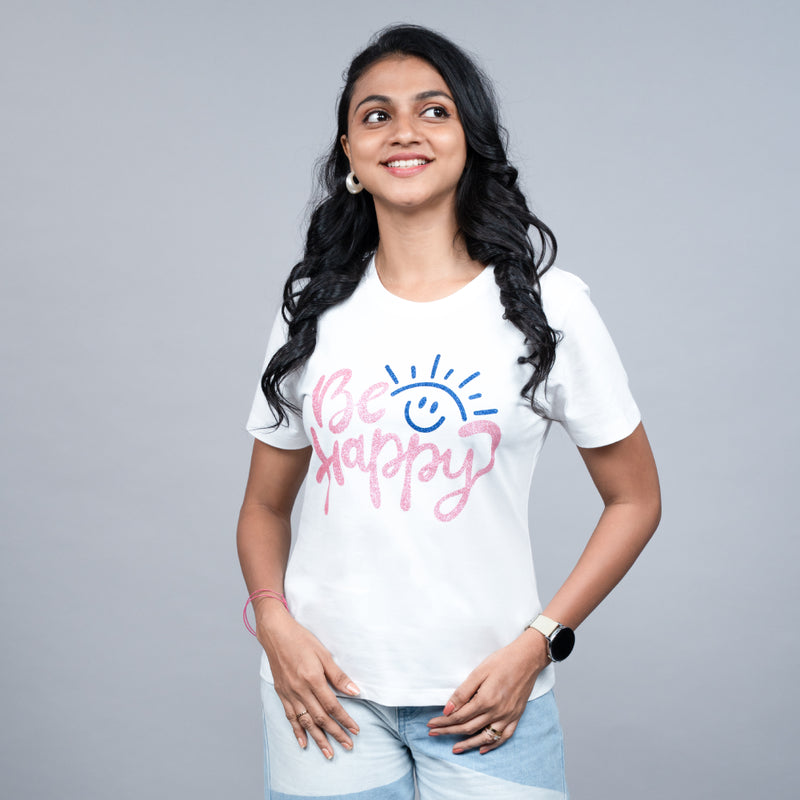 Angled side view of white Be Happy tee on model, showing relaxed fit and sparkle