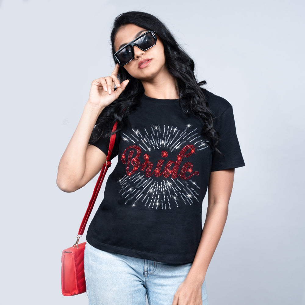 Close-up of black “Bride” tee showcasing glitter “Bride” text detail on ultra-soft cotton