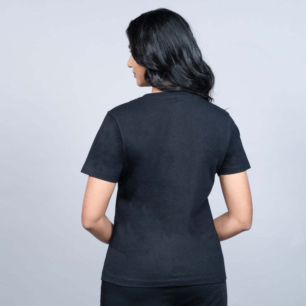 Side-angle of black “Queen” tee showcasing relaxed fit and shimmering text detail