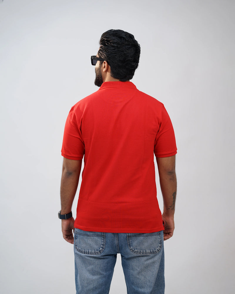 Back view of red polo tee showcasing clean lines and premium cotton finish