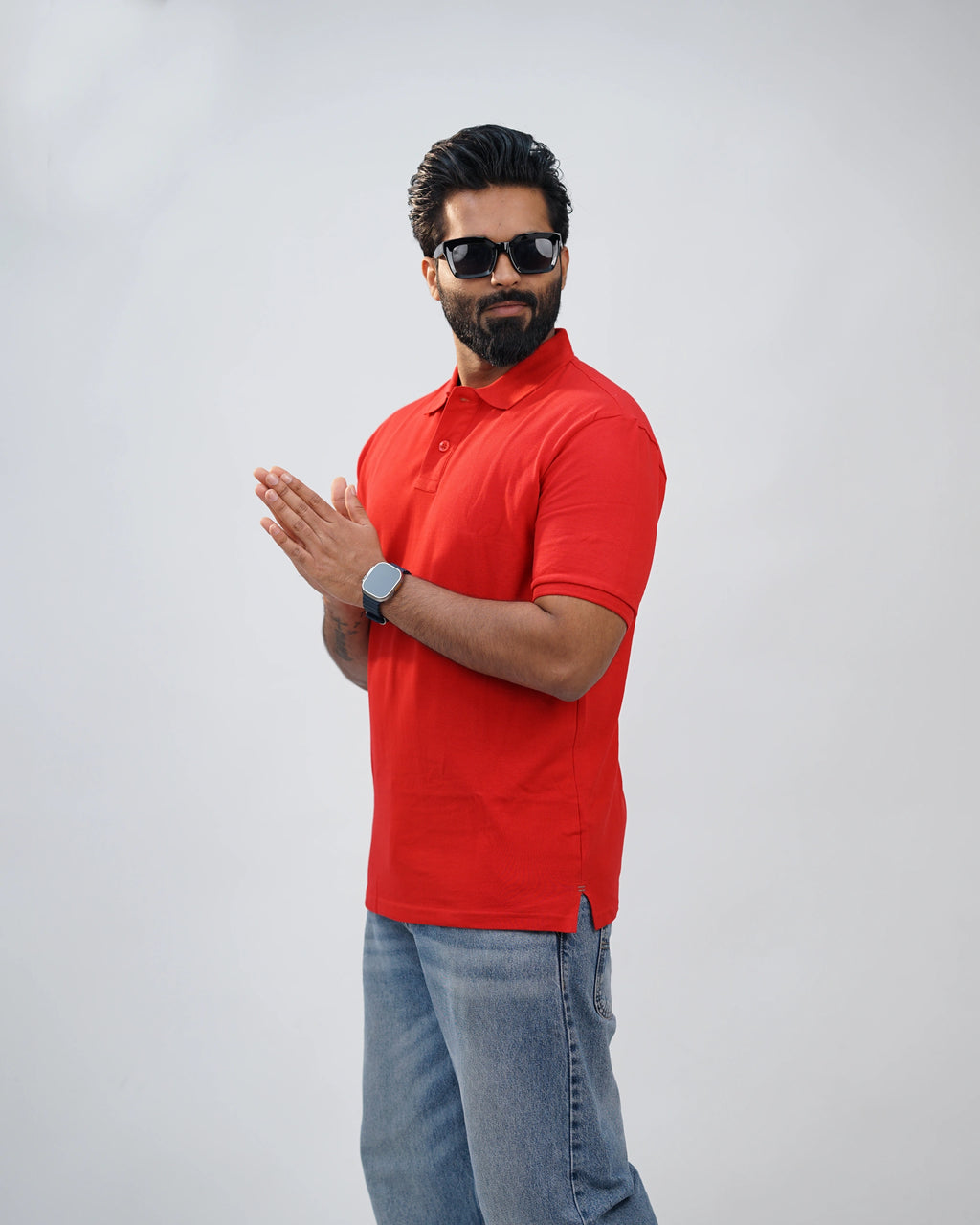 Man dressed casually in bold red polo tee—effortless comfort meets confident style