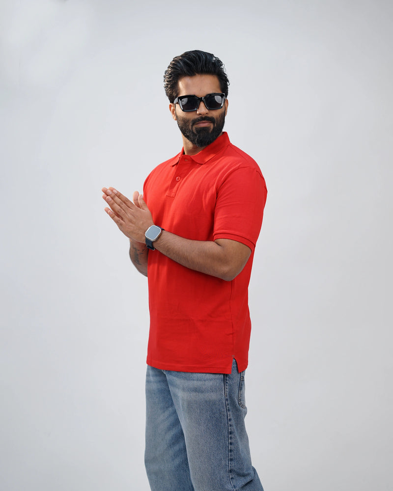 Man dressed casually in bold red polo tee—effortless comfort meets confident style