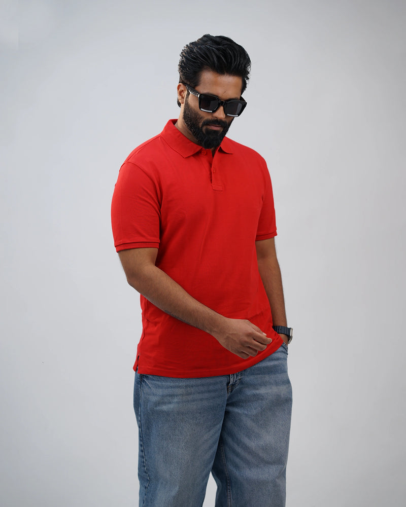 Side shot of red polo tee highlighting its relaxed yet structured fit