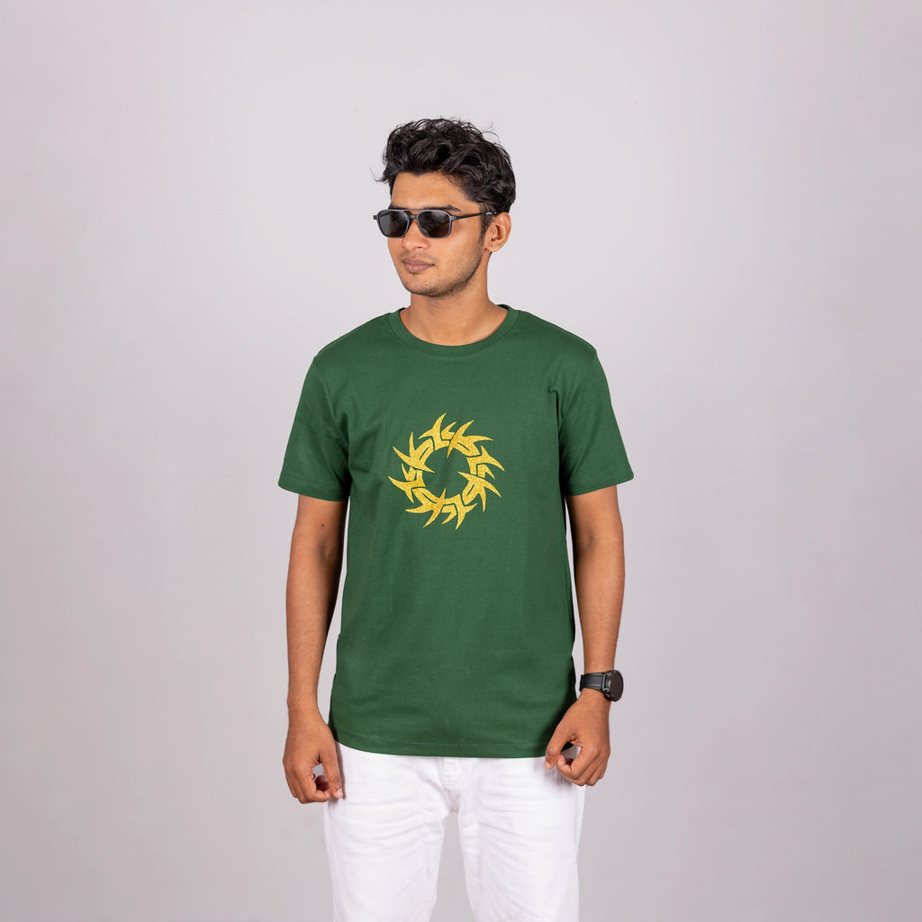 Man walking in bottle green tee with urban ease—glitter graphic meets dynamic movement