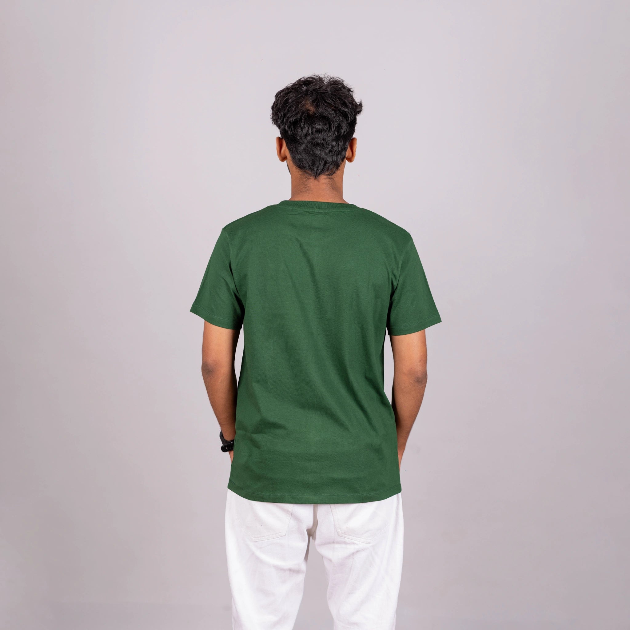 Back view of bottle green tee showing smooth silhouette and premium cotton drape