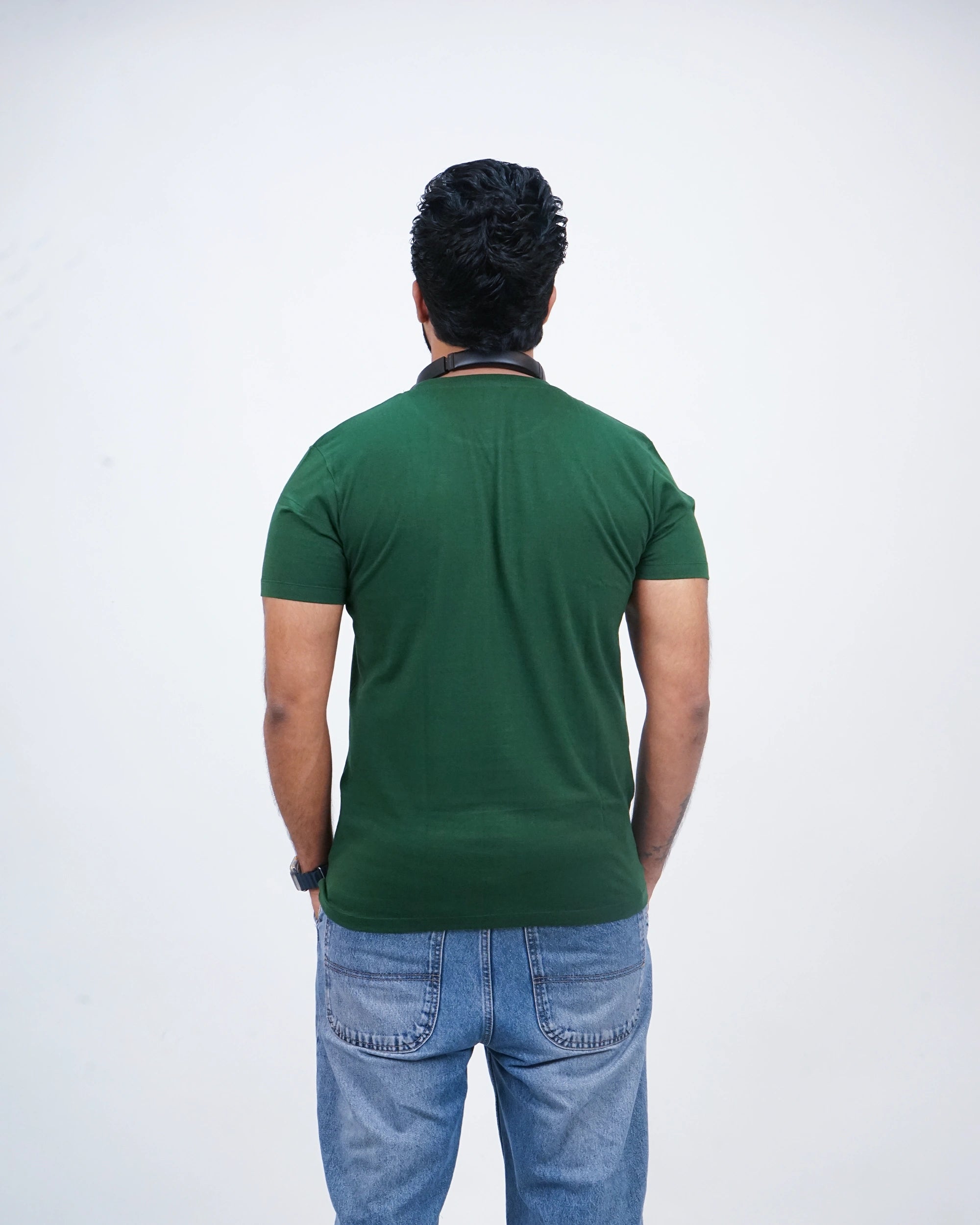 Back view of bottle green round neck tee for men featuring clean line and comfort-driven cut