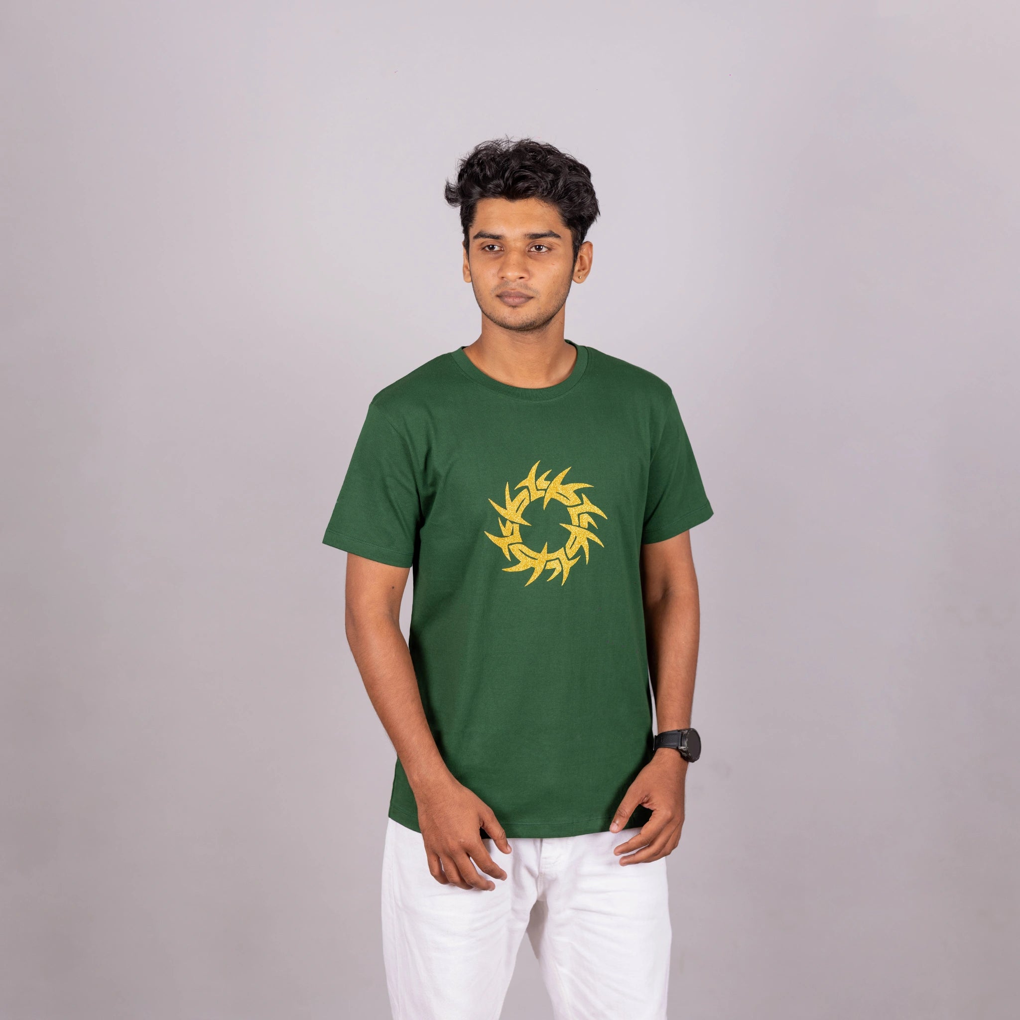 Man wearing bottle green tee with glitter “Tribal Tech Circle” print—bold, modern comfort in India