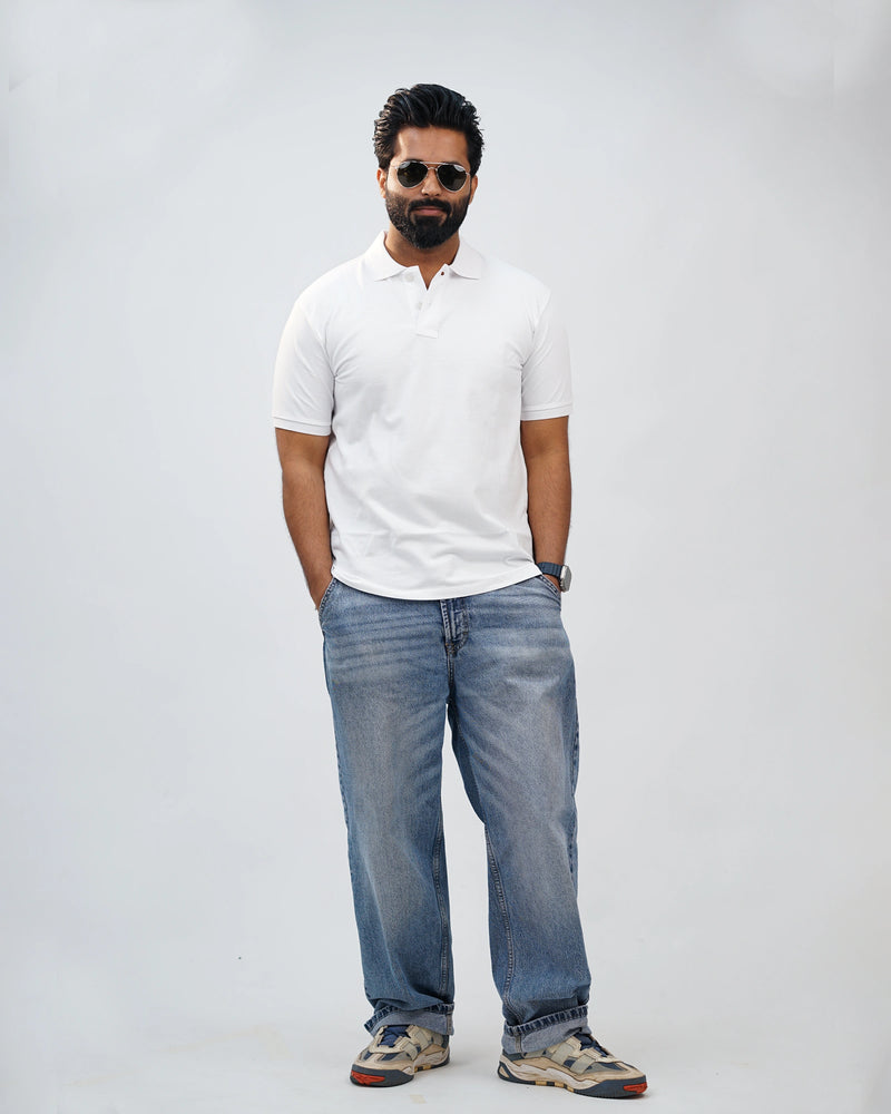Close-up of white polo tee highlighting soft bio-washed collar and buttons