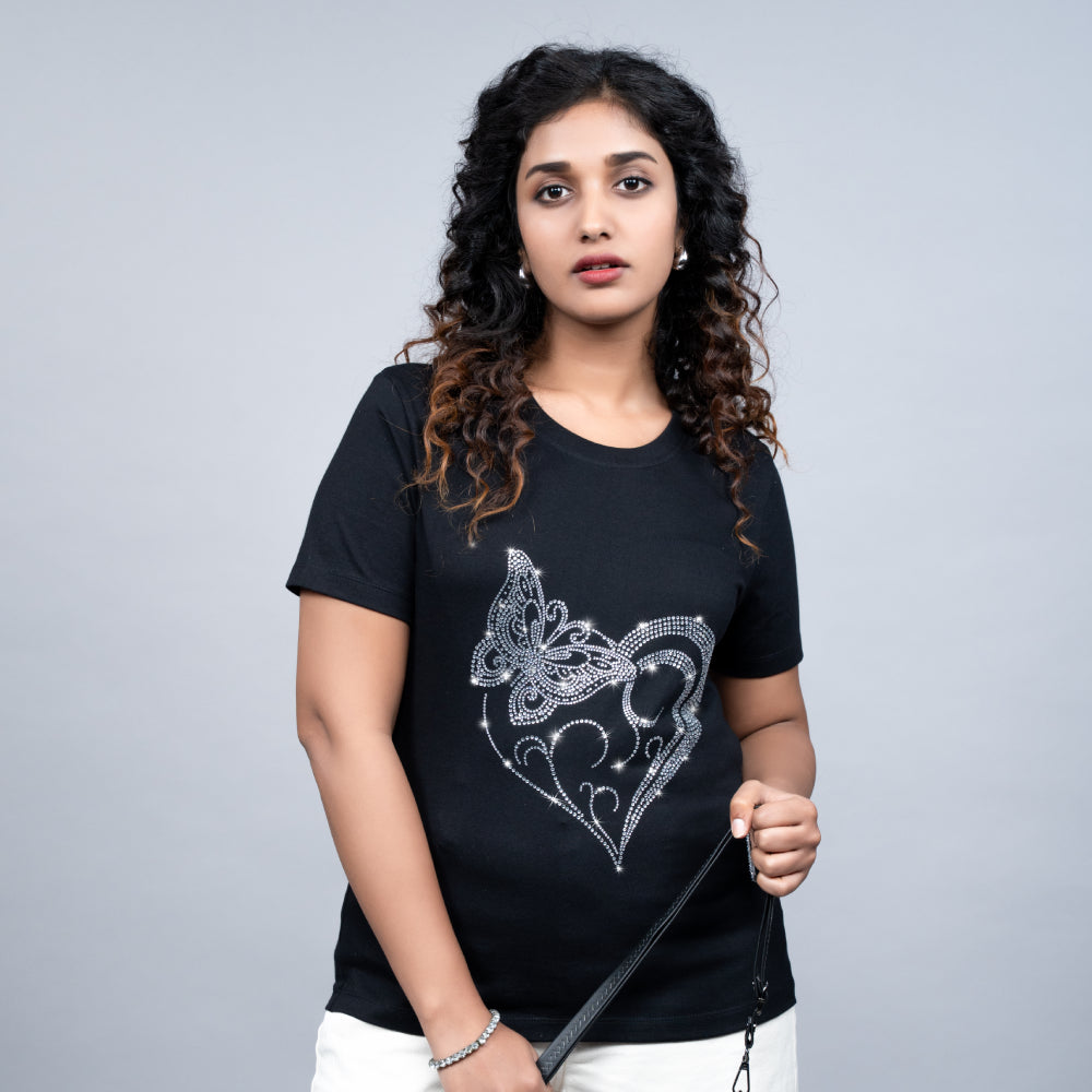 Front view of black Heart Butterfly tee on model showing shimmering motif