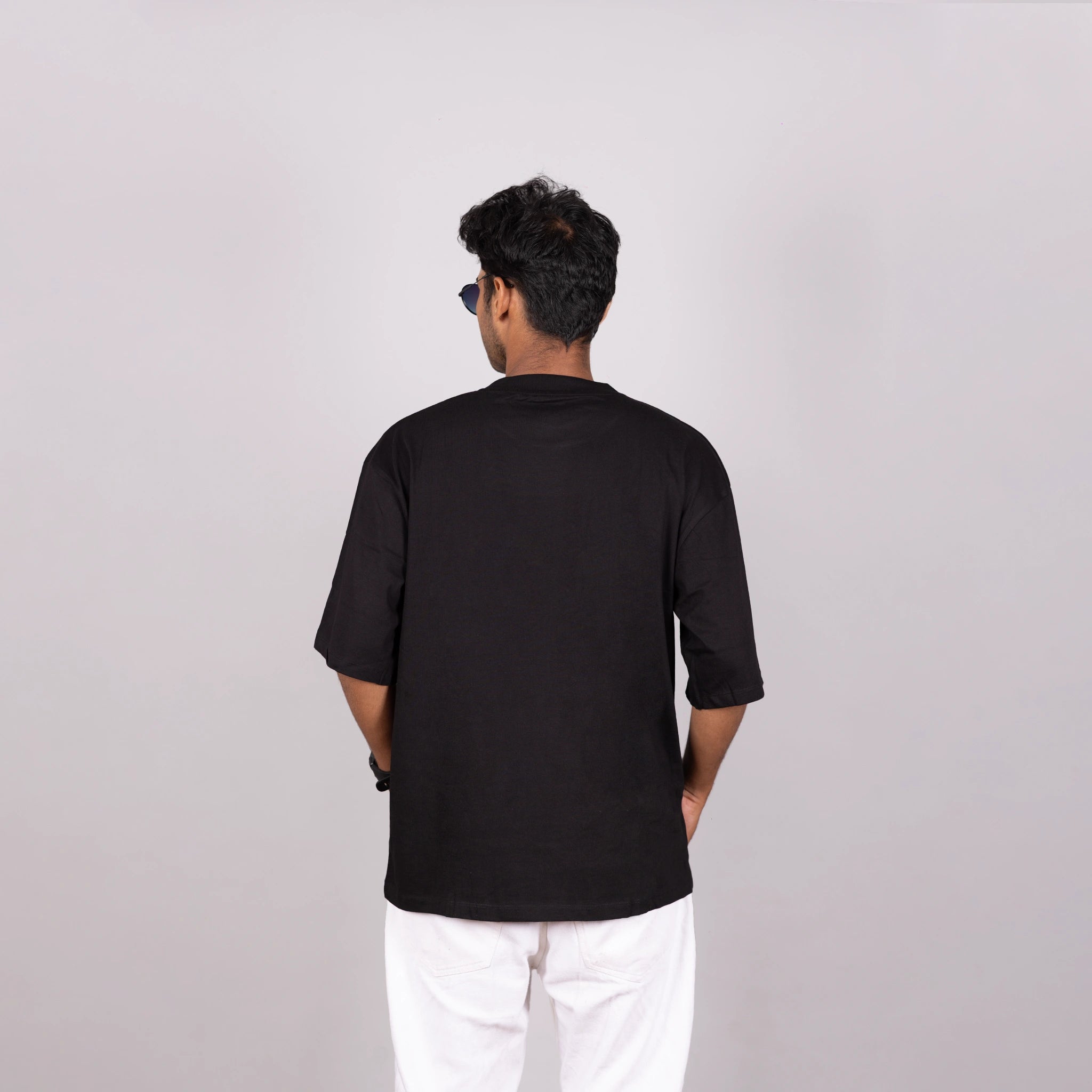 Back view of oversized tee, clean silhouette and premium drape