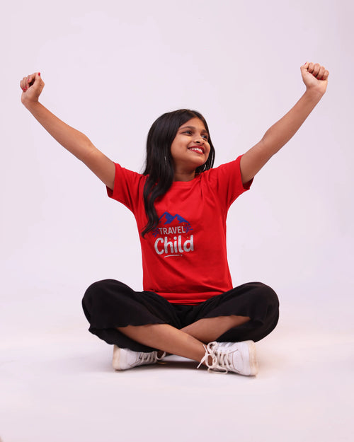 Side pose of “Travel Child” kids tee—relaxed fit, travel-inspired design