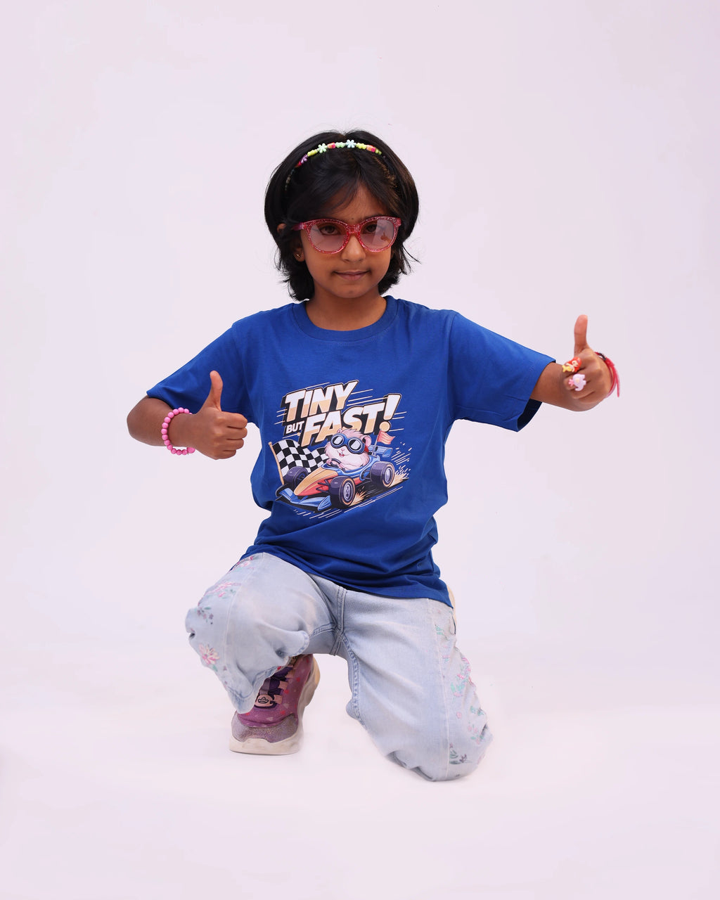Side pose of royal blue “Tiny but Fast” unisex kids tee