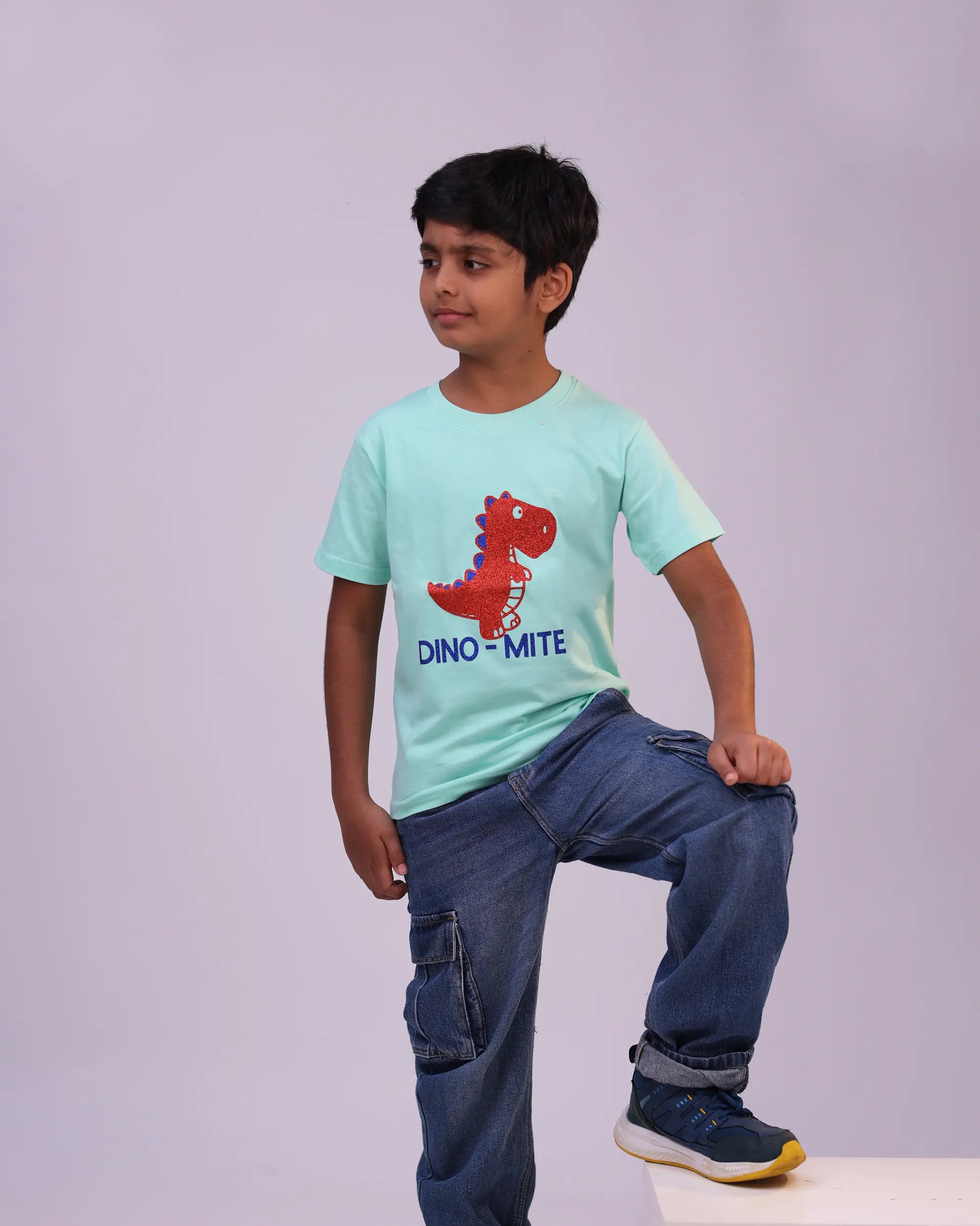 Kids wearing Dino-mite mint green unisex tee with fun pose