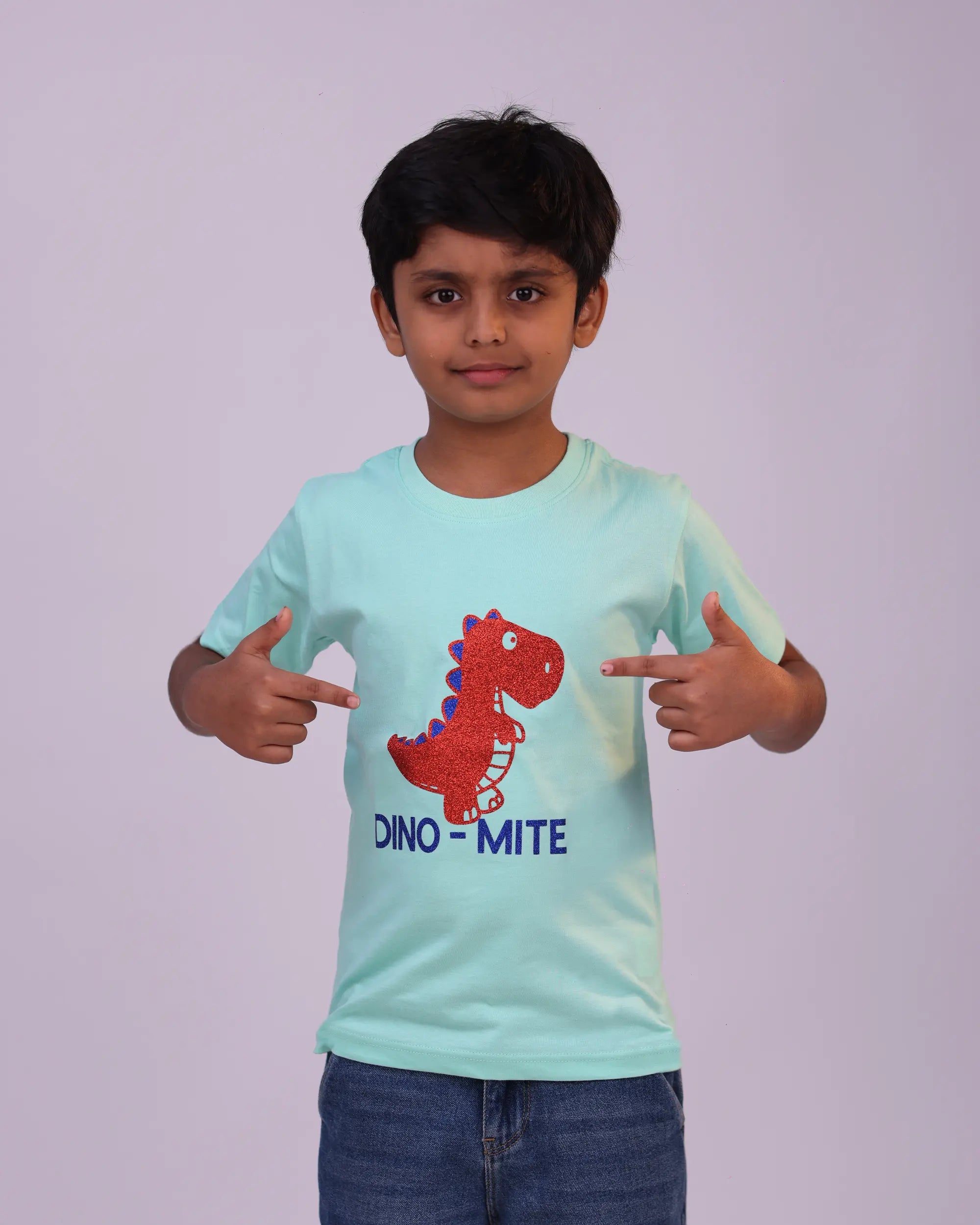 Dino-mite unisex kids t-shirt in mint green – front view