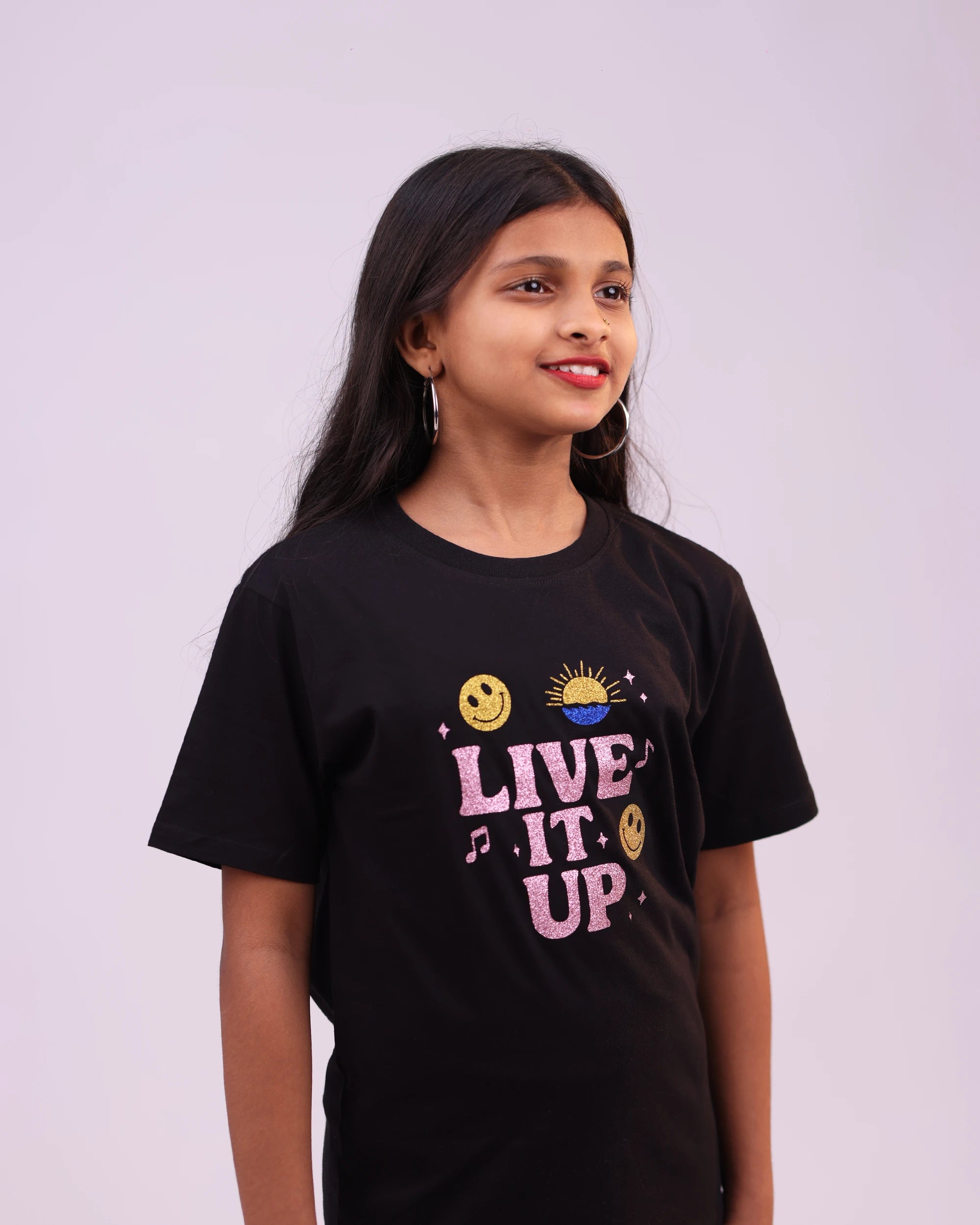 Kid in “Live It Up” tee having fun — energetic, carefree, unisex style