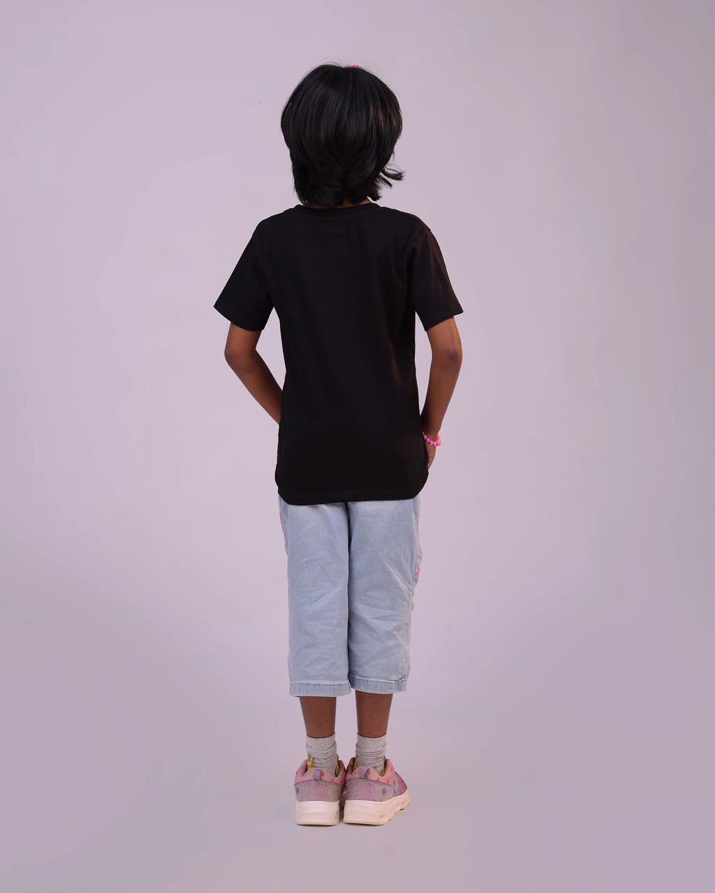 Back view of “Space Explorer” unisex girls tee—clean silhouette and comfy shape