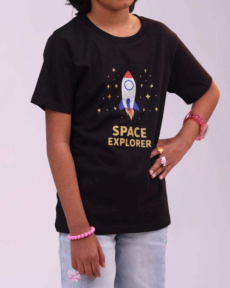 Close-up of the “Space Explorer” print—glimmering design on cozy kids tee fabric