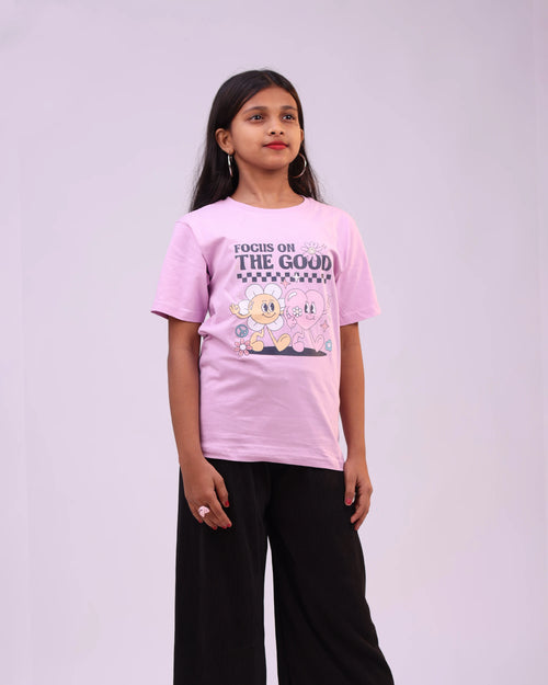 Side profile of “Focus on the Good” kids tee—relaxed fit, uplifting vibe