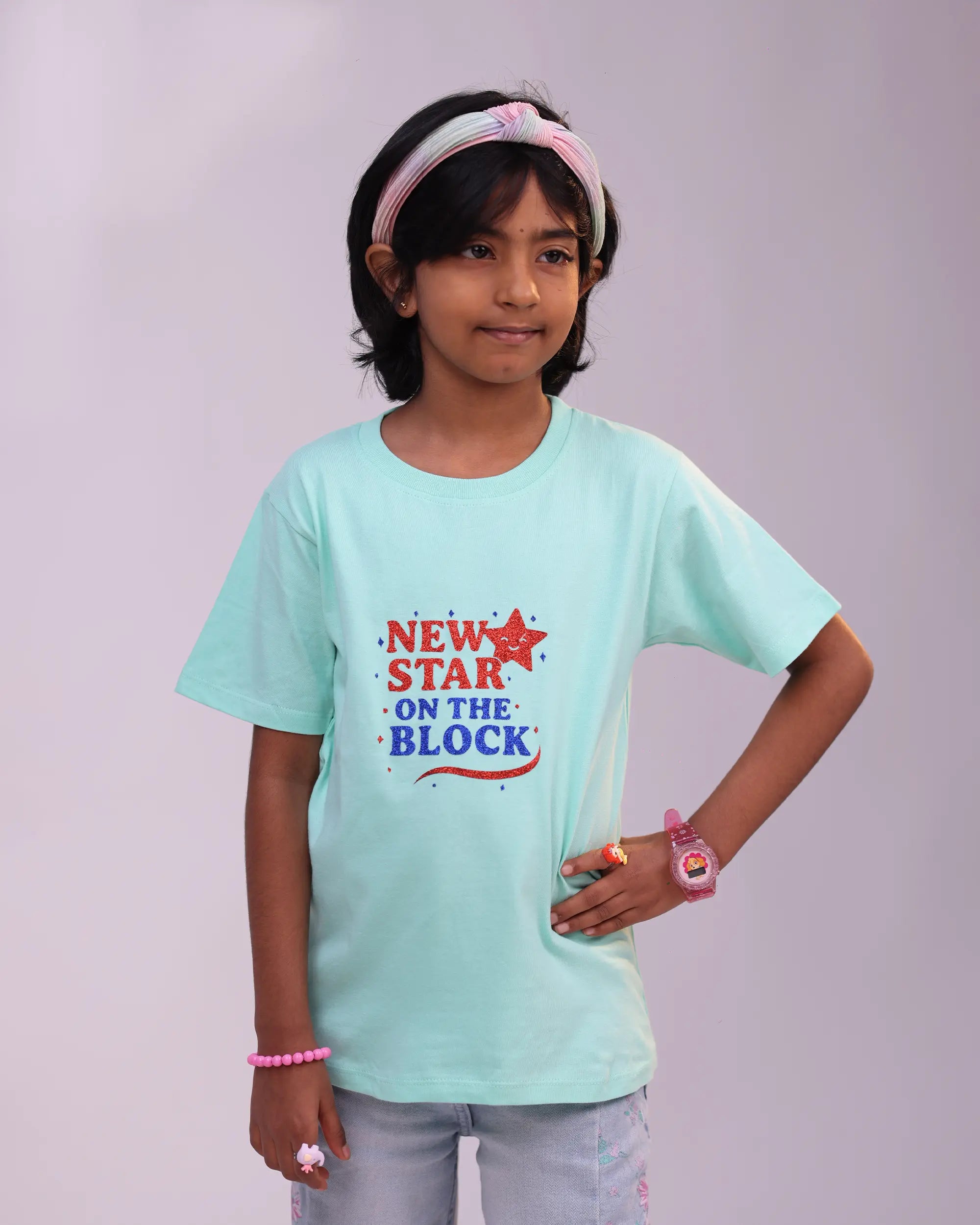 Side profile of mint “Star” tee—soft fit with fun star design
