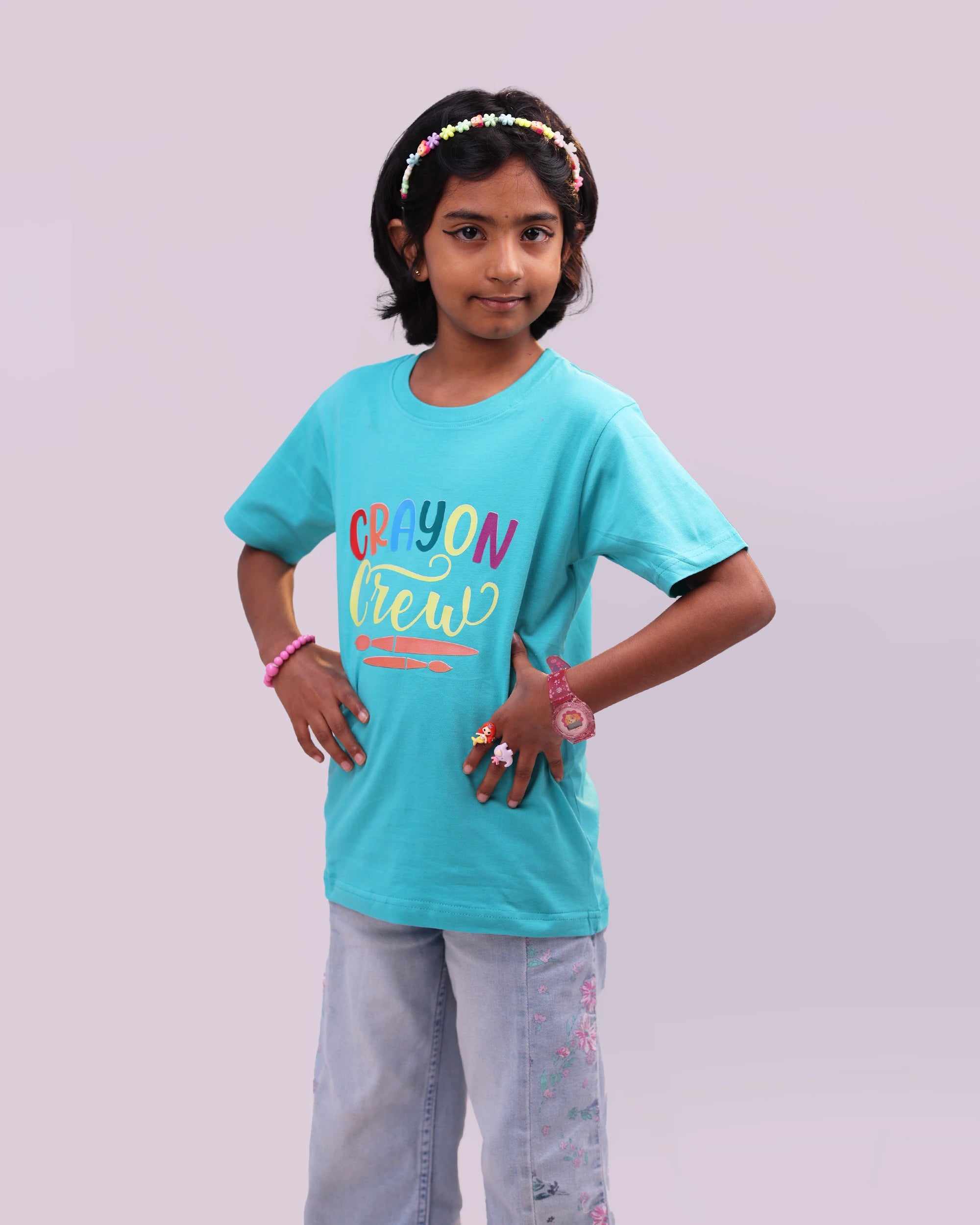 Close-up of crayon-inspired graphic on soft cotton “Crayon Crew” kids tee