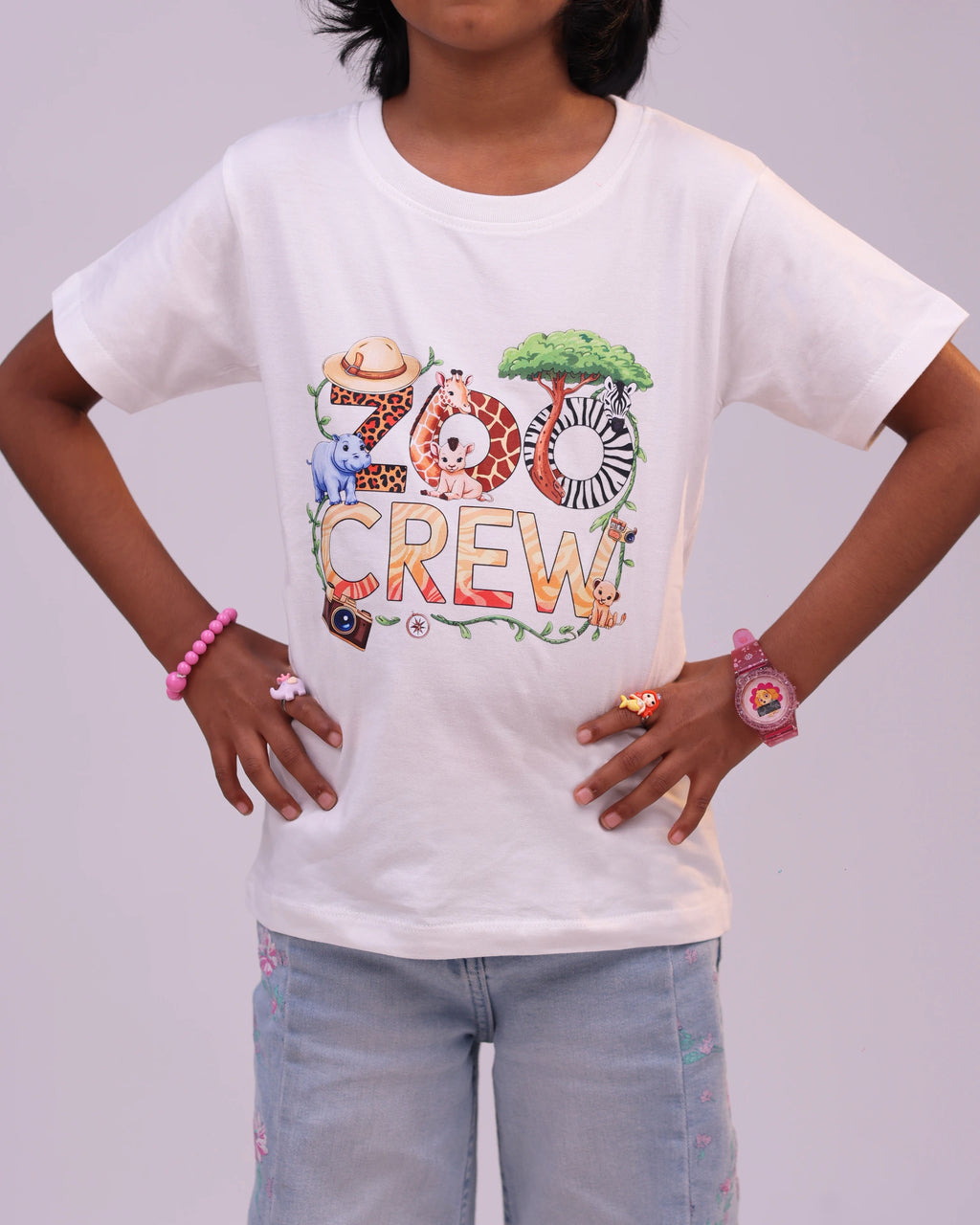 Close-up of animal-inspired “Zoo Crew” print on soft white tee