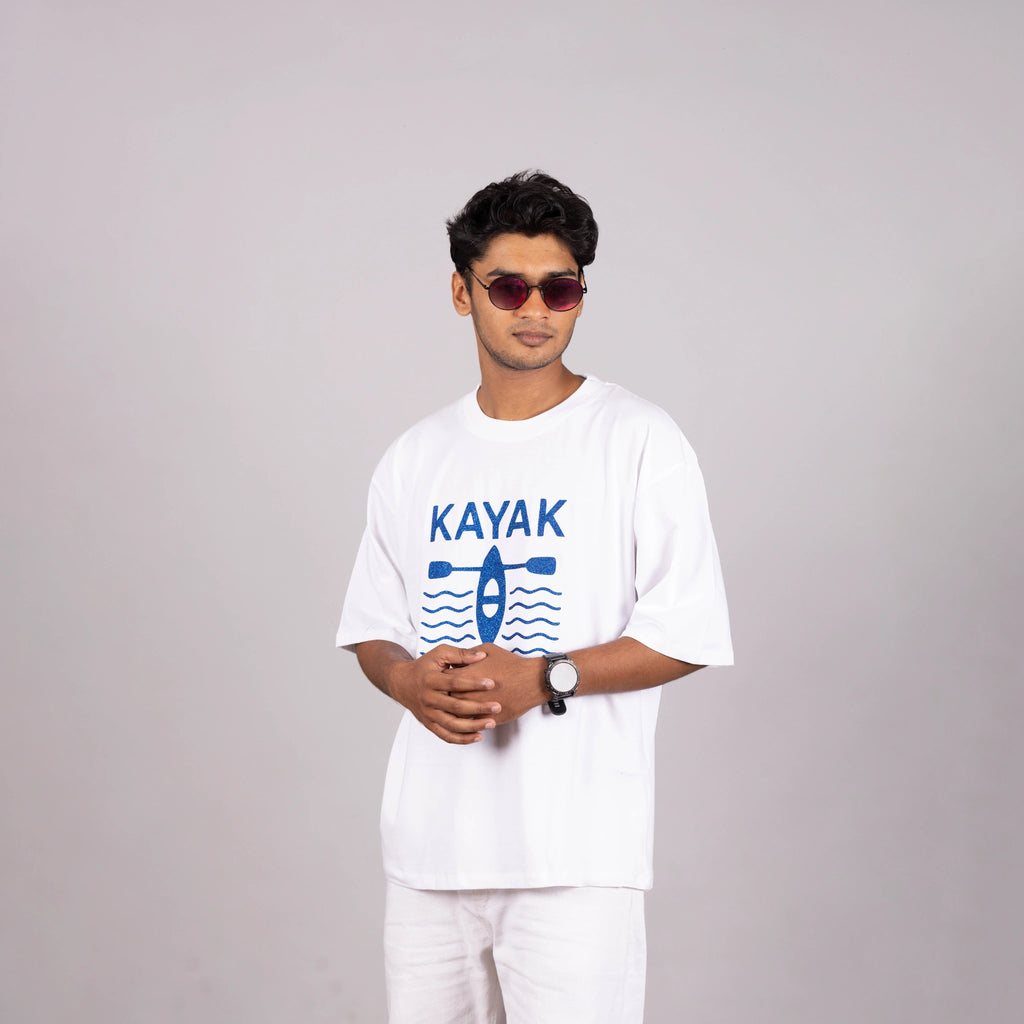 Man walking outdoors in “Kayak” tee—embrace the day in comfort and style