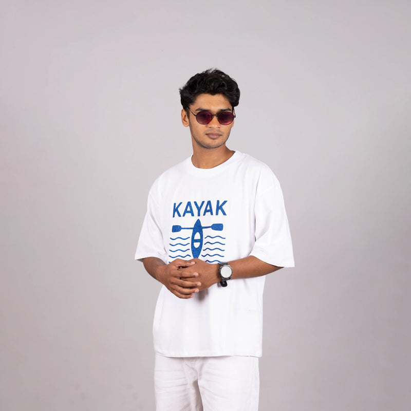 Man walking outdoors in “Kayak” tee—embrace the day in comfort and style