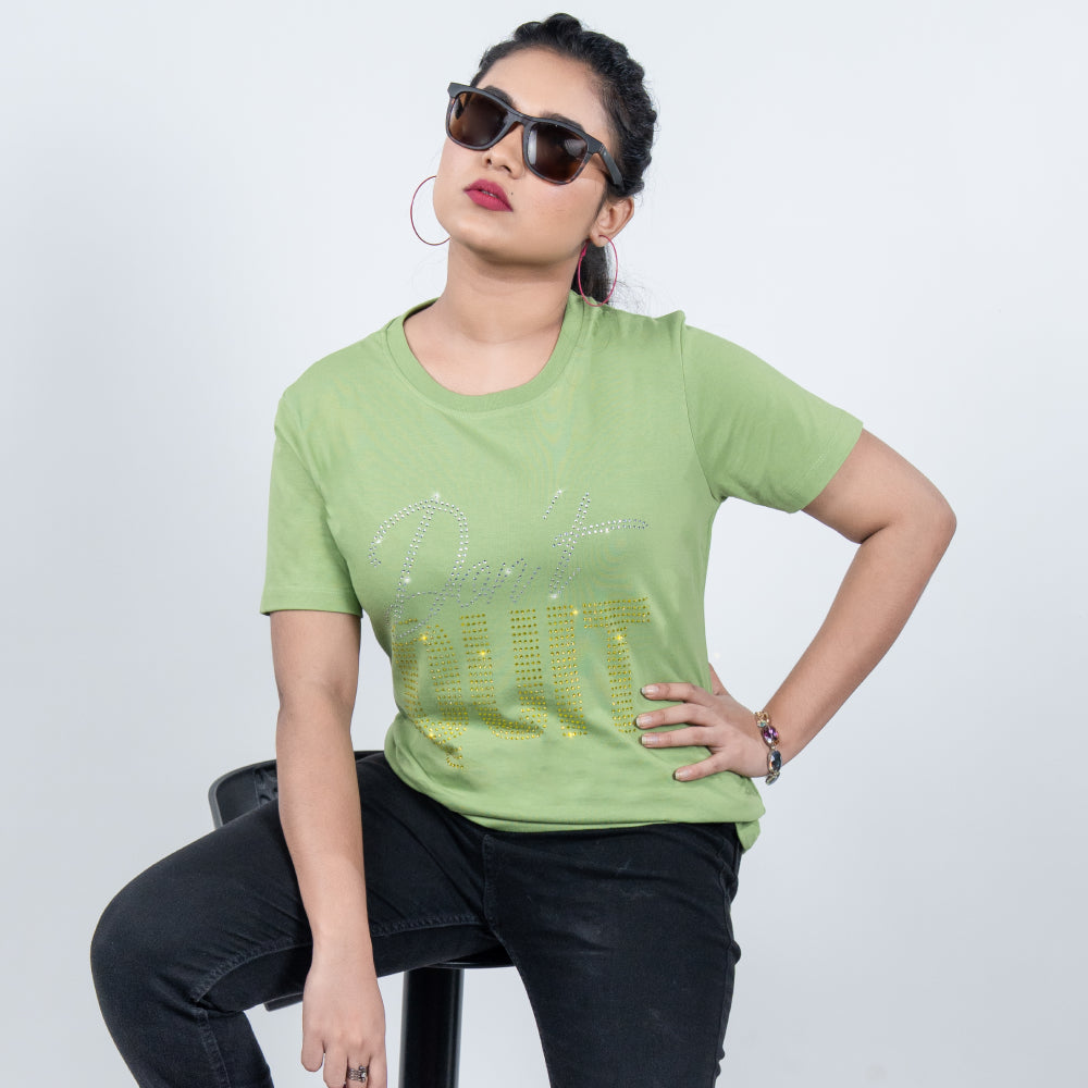Woman wearing 'Don't Quit' tee styled with joggers for active, motivational vibe