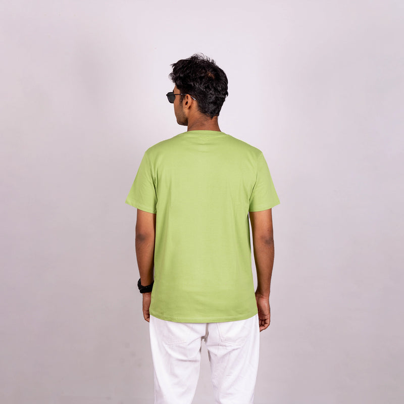 Back view of kiwi green tee showcasing smooth finish and relaxed silhouette