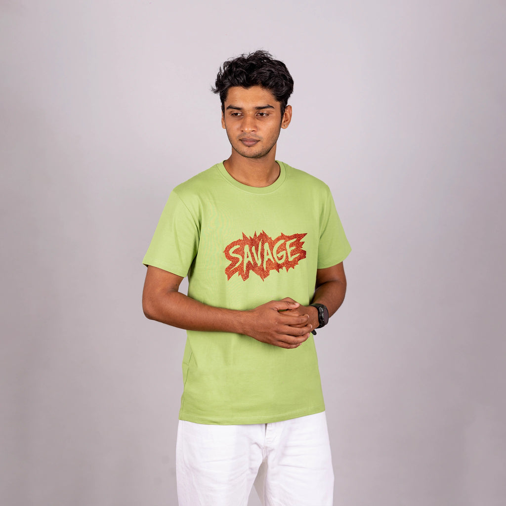 Man walking in kiwi green Savage tee—confidence and movement captured in an urban moment