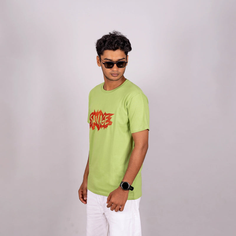 Side profile of kiwi green Savage tee showing relaxed fit and reflective print