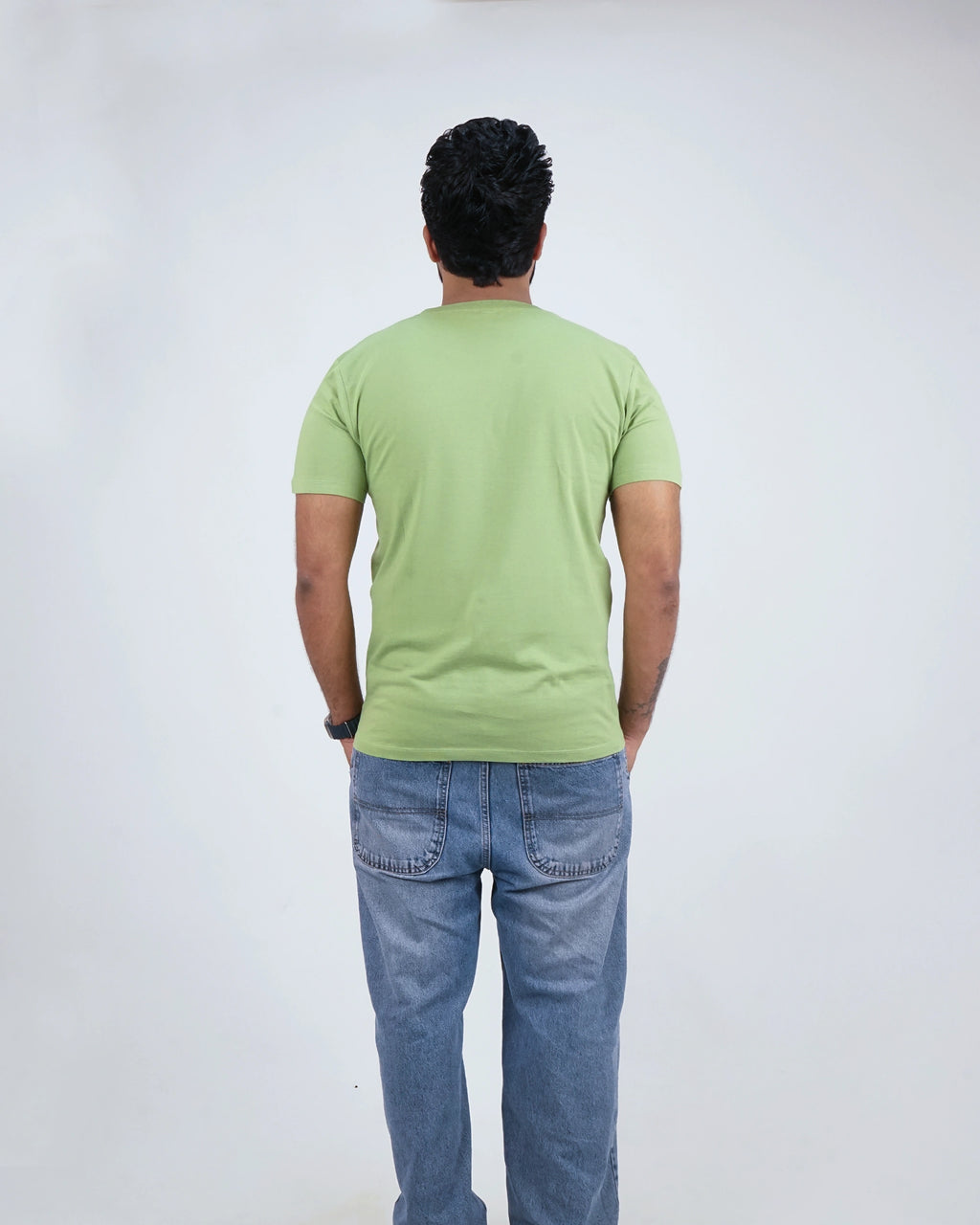 Back view of Kiwi Green round neck tee for men, showcasing smooth finish and clean design