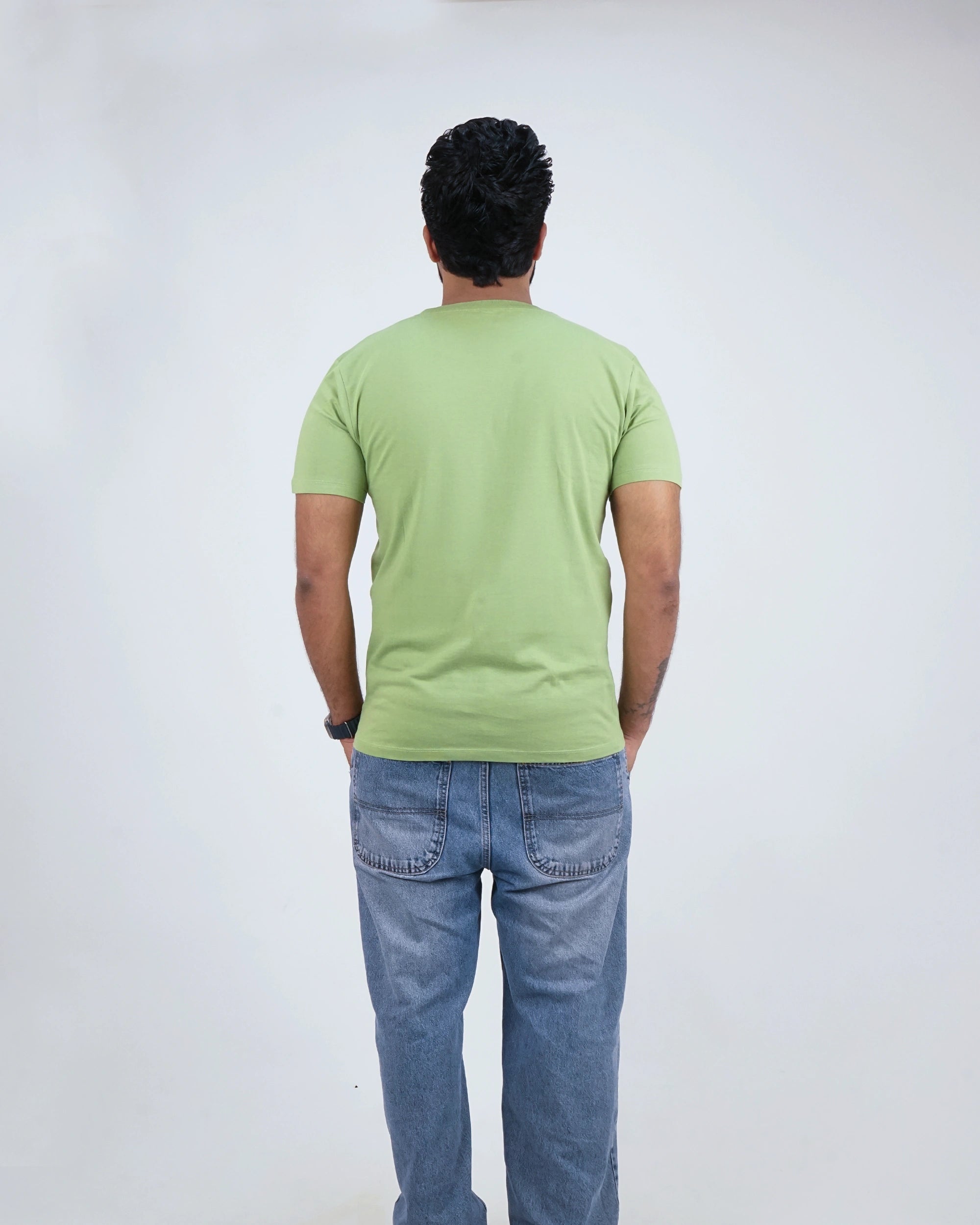 Back view of Kiwi Green round neck tee for men, showcasing smooth finish and clean design