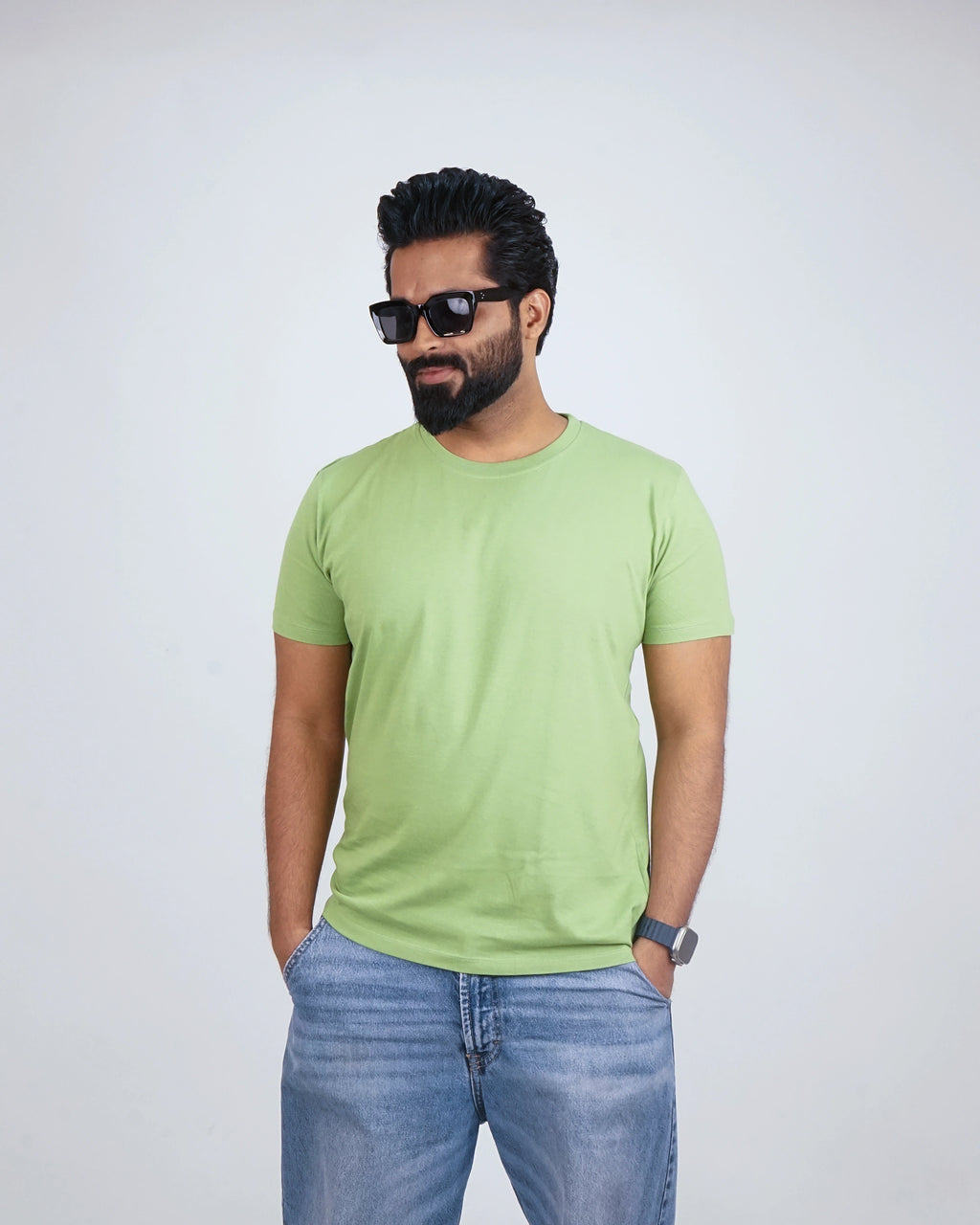 Side view of Kiwi Green round neck tee for men, highlighting relaxed fit and drape