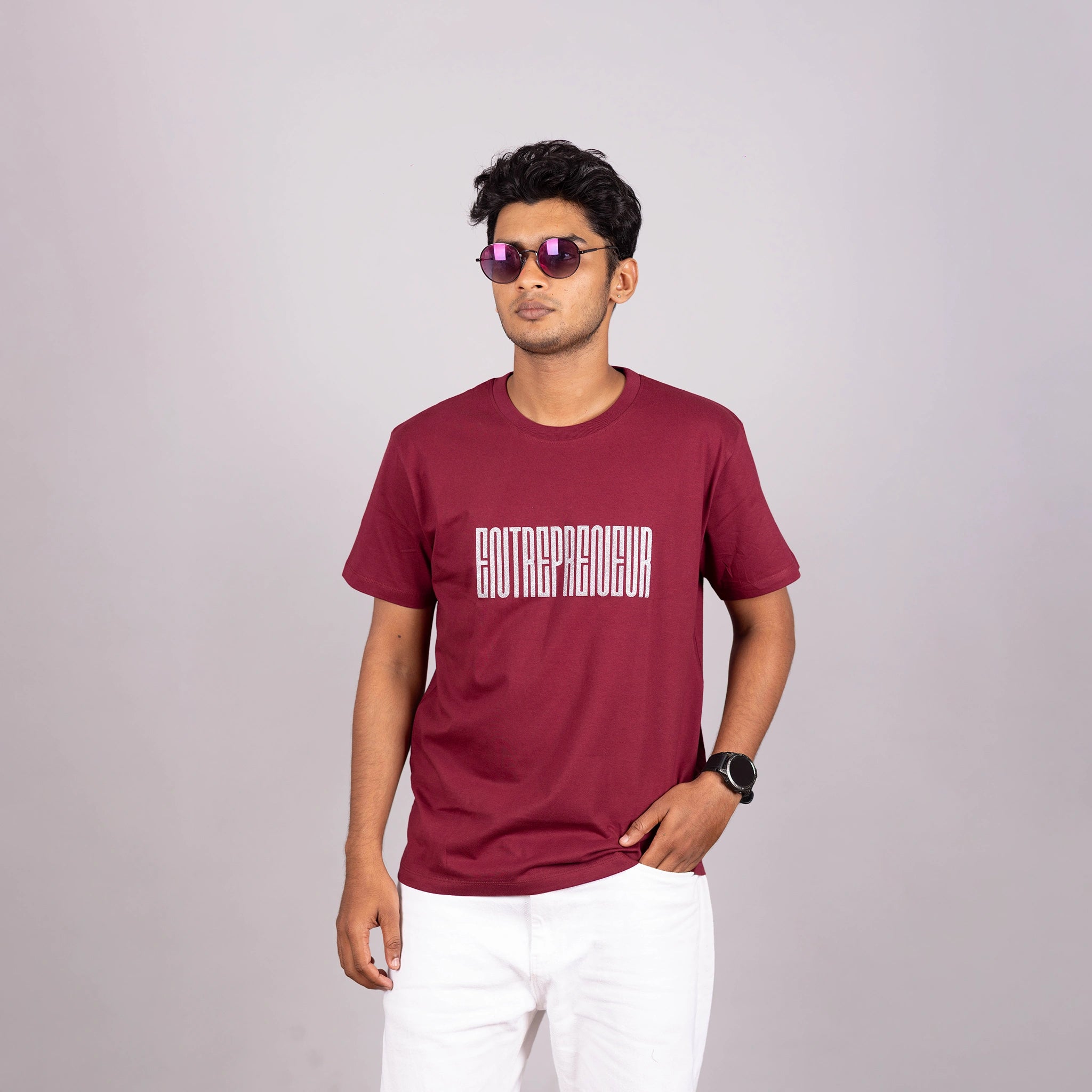 Man wearing maroon “Entrepreneur” tee with typography—casual confidence and bold edge