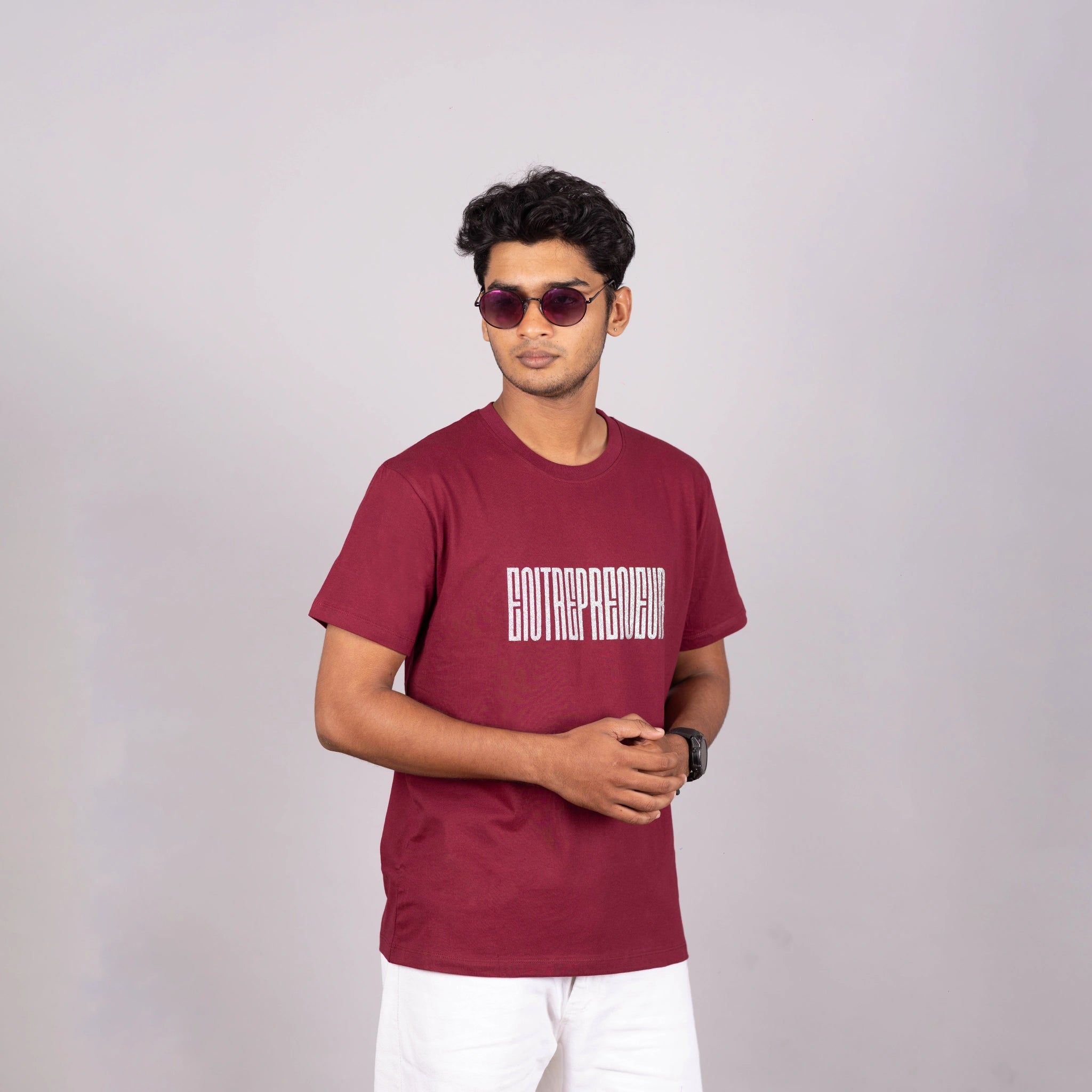 Slight side view of maroon “Entrepreneur” tee—relaxed fit showing graphic and fit
