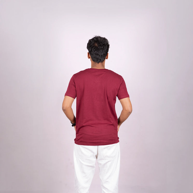 Back of maroon tee emphasizing clean silhouette, luxe fabric, and premium drape