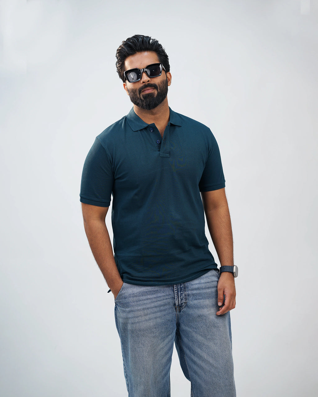 Man wearing midnight teal polo with chinos—effortless sophistication in casual style