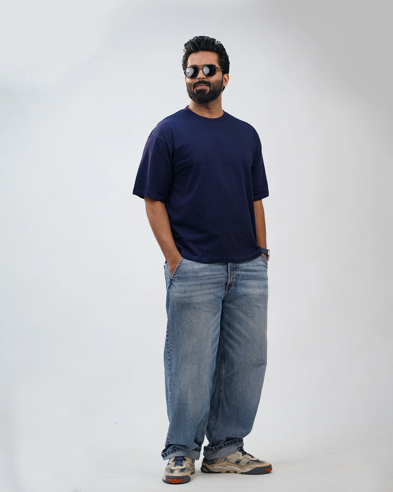 Close-up of navy blue oversized tee showcasing soft cotton texture and clean seams