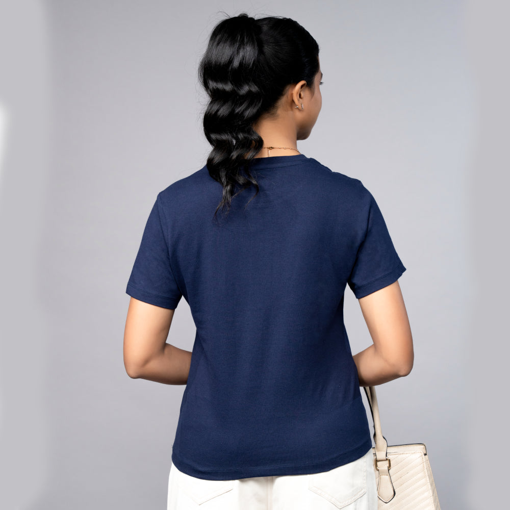 Back-angle of navy blue tee showing relaxed fit and sparkling party shoe motif—effortless statement style