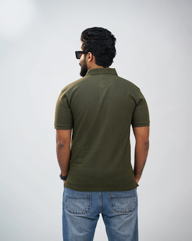Back view of olive green polo tee showcasing clean silhouette and premium cotton finish
