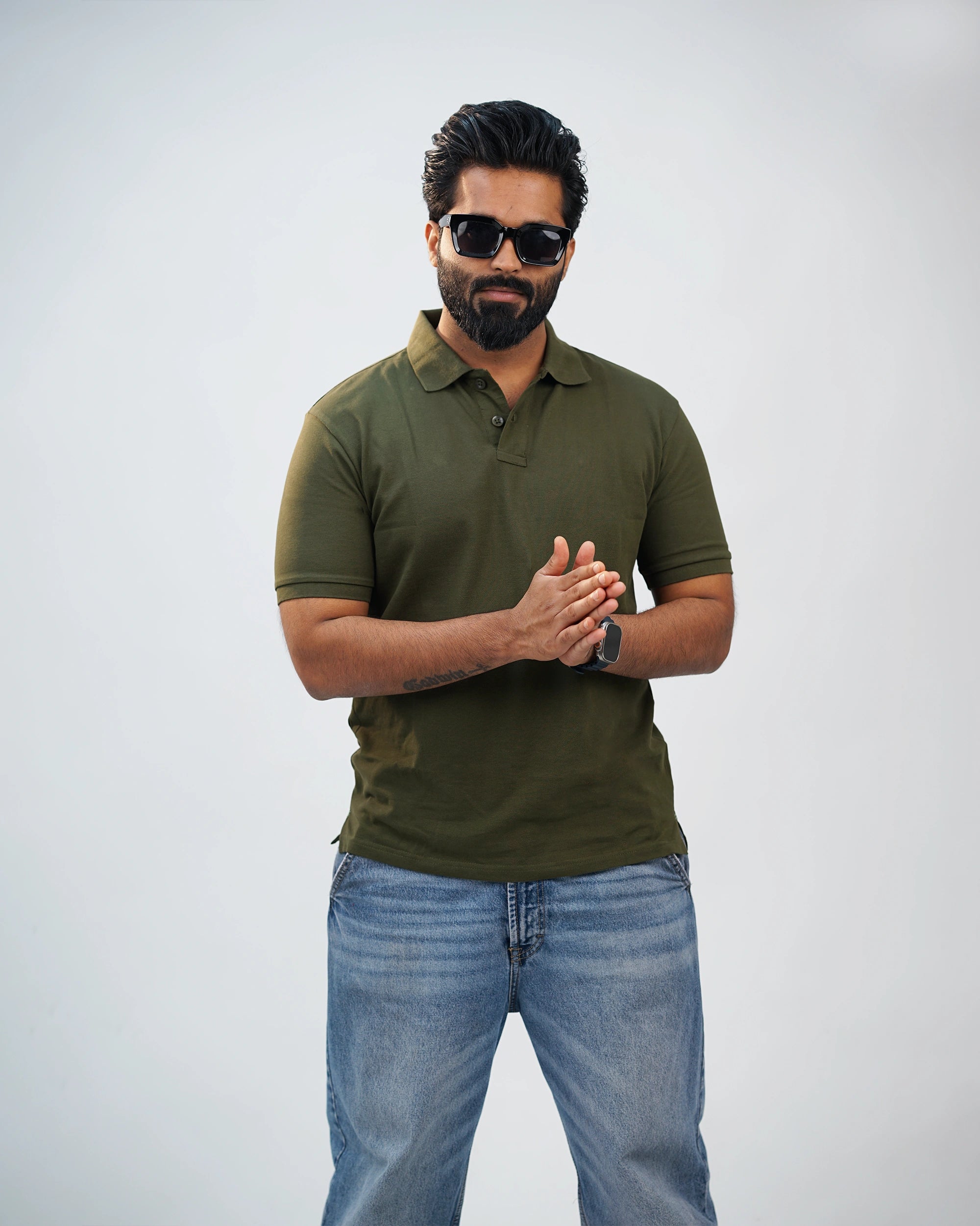 Man wearing olive green polo tee with chinos—relaxed refinement meets timeless style