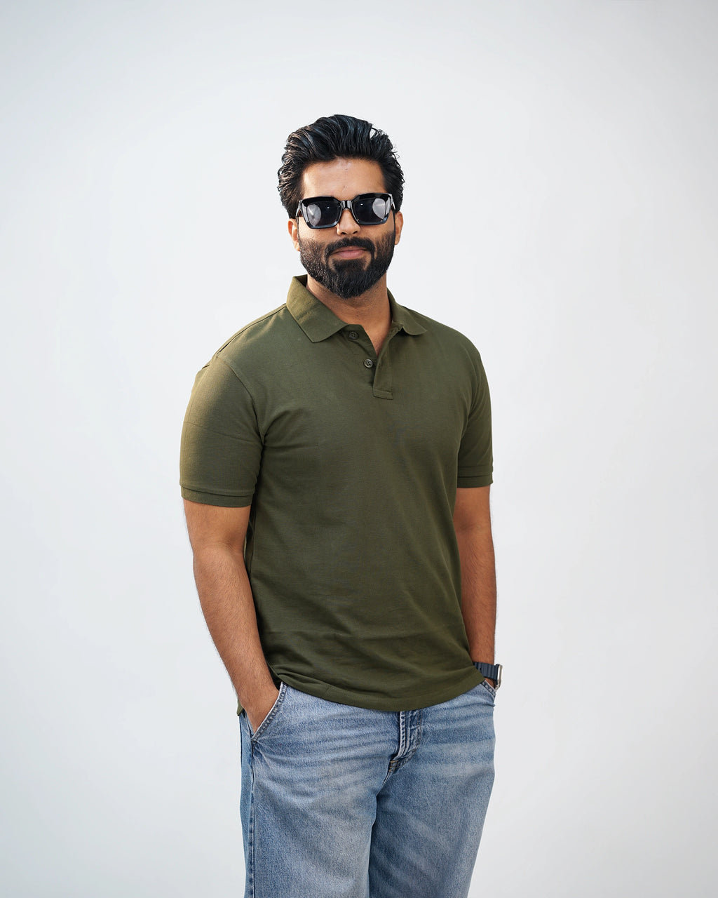 Man walking outdoors in olive green polo tee—urban ease meets move-ready comfort