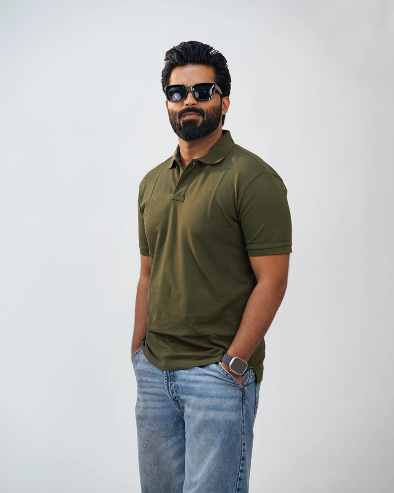 Side-angle view of olive green polo tee highlighting relaxed fit and smooth fabric