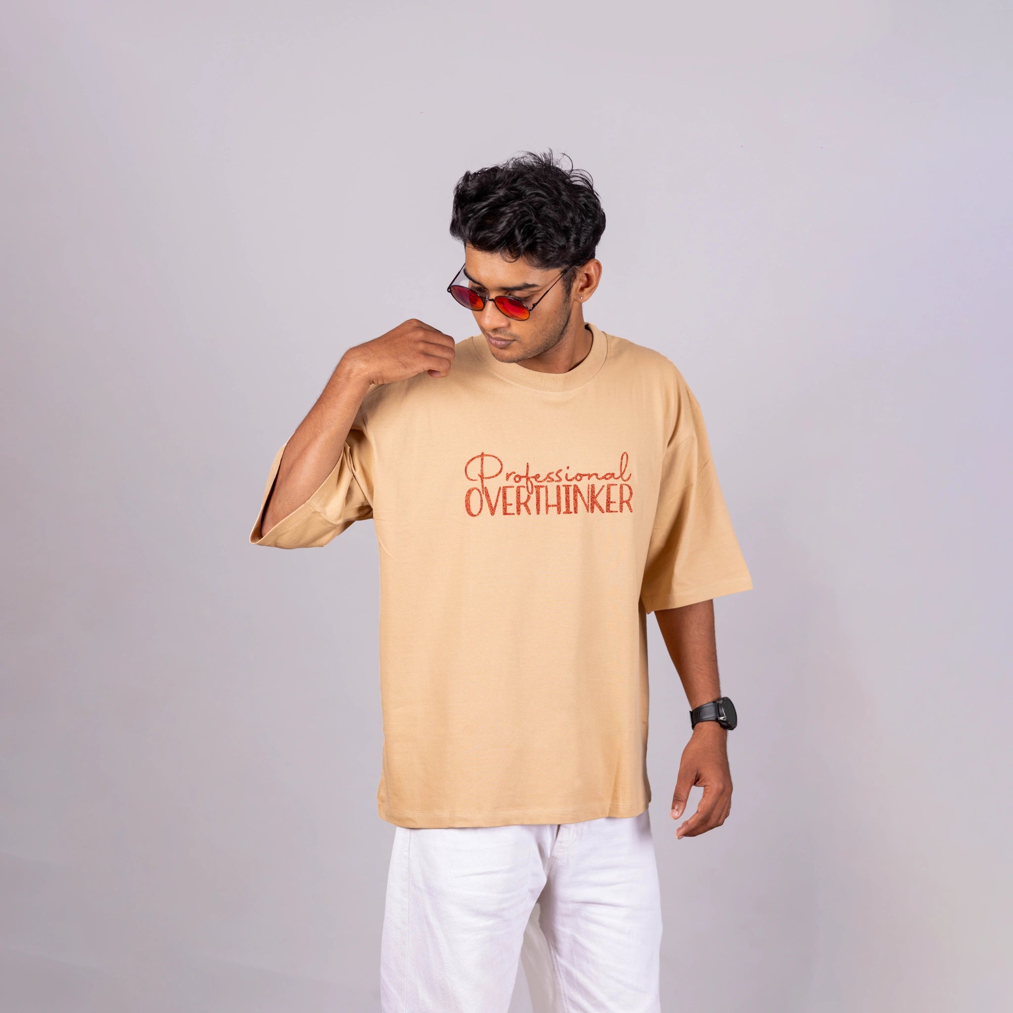 Man wearing “Professional Overthinker” oversized tee with joggers—casual wit and relaxed vibes