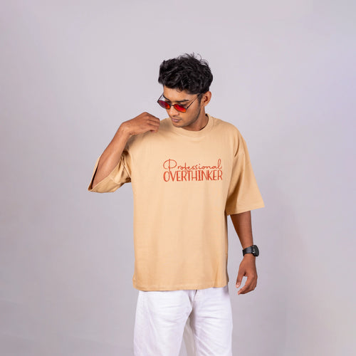 Man wearing “Professional Overthinker” oversized tee with joggers—casual wit and relaxed vibes