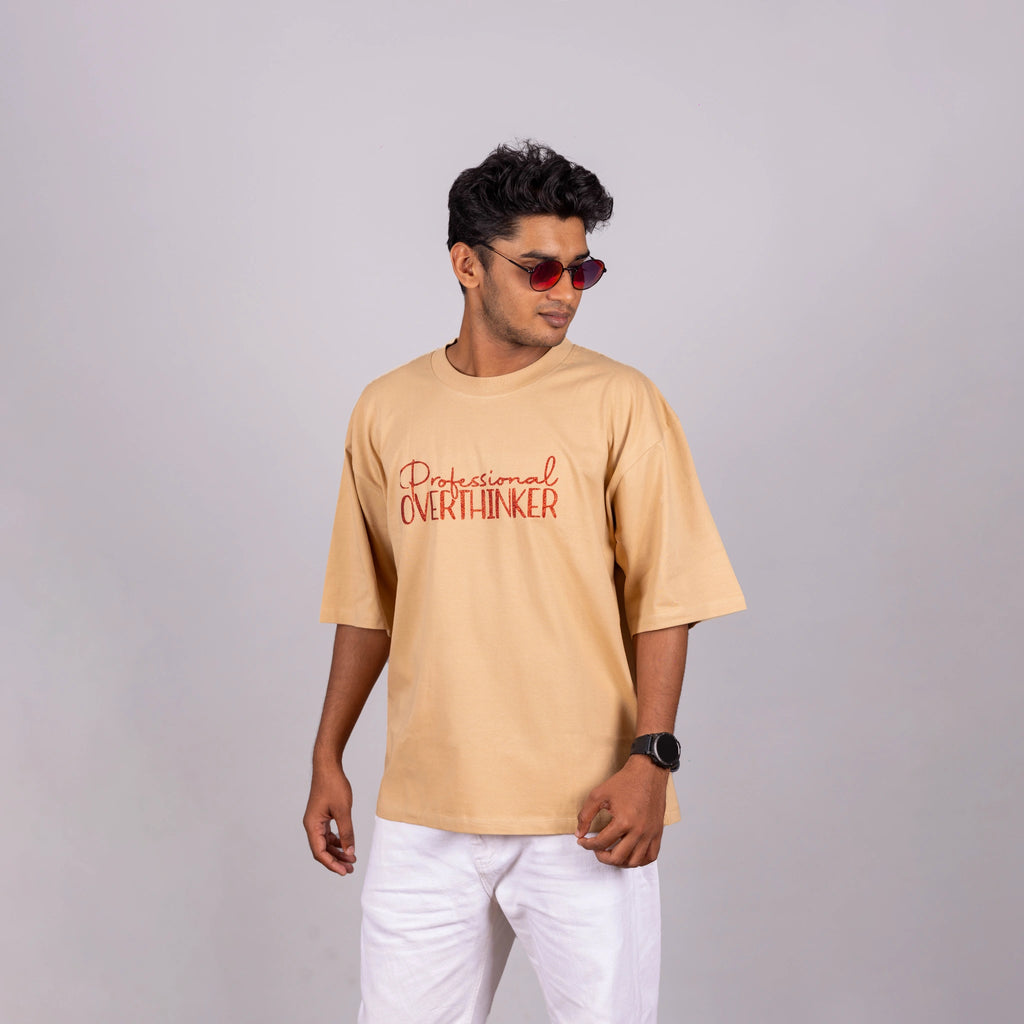 Side view of Oversized “Professional Overthinker” tee, showing loose fit and speech-starter text